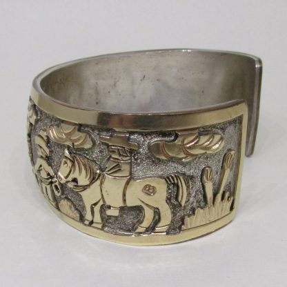Side view of Floyd Becenti Navajo Sterling Silver and Gold Filled Story Teller Bracelet