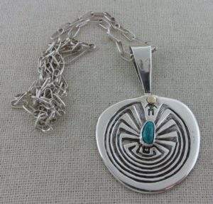 JAMES FENDENHEIM Tohono O’odham Man-in-the-Maze Sterling Silver and Turquoise Pendant