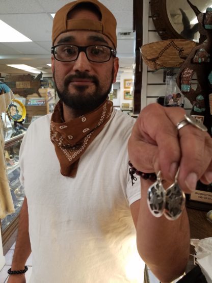 Adam Ramirez Silversmith with his Butterfly Earrings