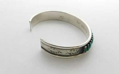 Side view of C + J OWAEBON Zuni Natural Turquoise Needlepoint Bracele