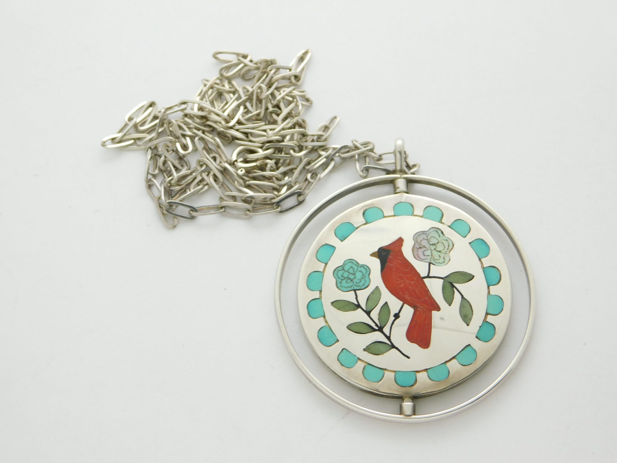 RANDOLPH AND MARGIE GHAHATE Zuni Spinner Sterling Silver and Stone Inlay Bird Pendant