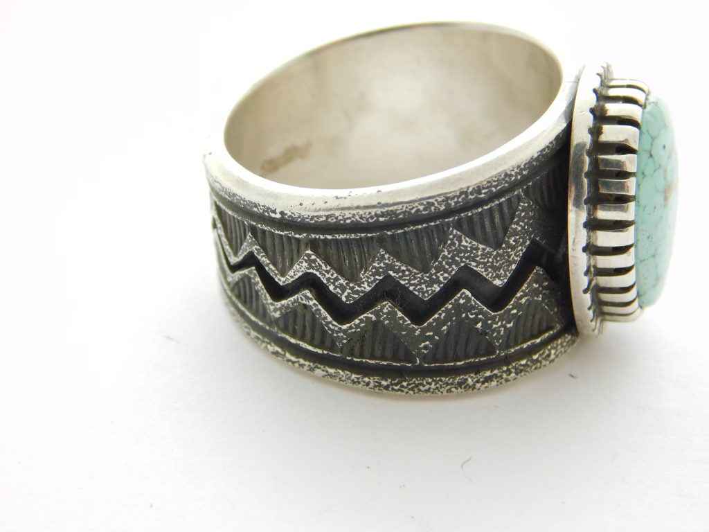 Side view of Aaron John Navajo Tufa Cast Sterling Silver and Turquoise Ring