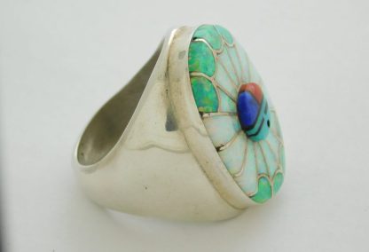 Side view of Amy Quandalacy Zuni Lab Opal, Turquoise, Lapis, Coral, and Black Onyx Sunface Sterling Silver Ring