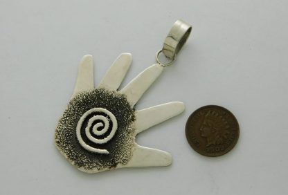 Reverse view of TIMM LEWIS Navajo Tribal Petroglyph Sterling Silver Hand Pendant