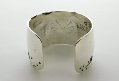 Rear view of James Fendenheim Tohono O'odham "The Man-in-the-Maze is Rising" Sterling Silver bracelet