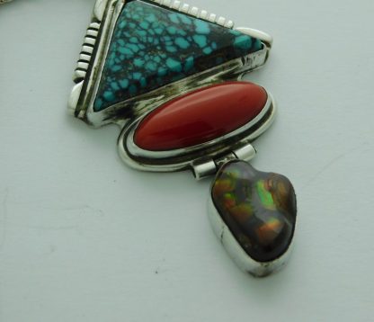 Close up of Charles Johnson Navajo Turquoise, Coral, and Fire Agate Sterling Silver Pendant