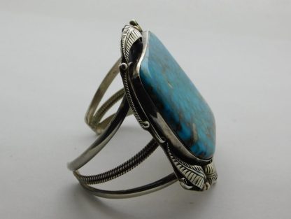 Side view of Herbert Tsosie Navajo Kingman Waterweb Turquoise and Sterling Silver Bracelet