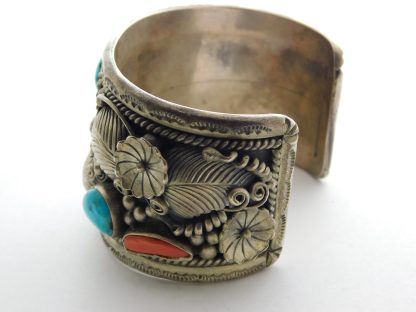 Side view of Morty Johnson Navajo Kingman Turquoise and Coral Sterling Floral Bracelet