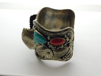 Side view of Morty Johnson Navajo Turquoise and Coral Sterling Watch Band
