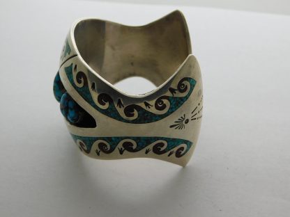 Side view of CHARLEY SINGER Navajo Silver Turquoise Coral Chip Bracelet