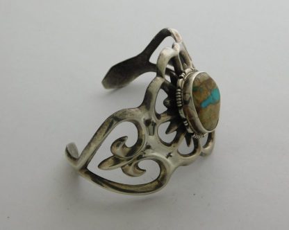 Side view of Francis L. Begay Navajo Royston Turquoise and Sterling Sand Cast Bracelet