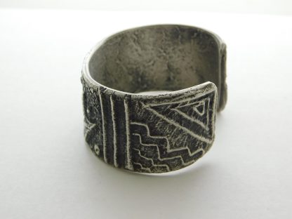 Side view of Stewart Billie Navajo Tufa Cast Silver Bracelet