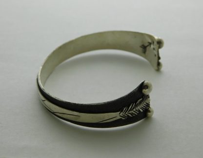 Side view of Adam Ramirez Arrow Bracelet