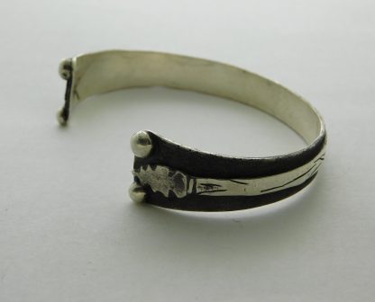 Side view of Adam Ramirez Arrow Bracelet