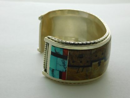 Side view of Gilber & Mildred Calavaza Zuni Bracelet