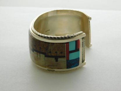 Side view of Gilber & Mildred Calavaza Zuni Bracelet