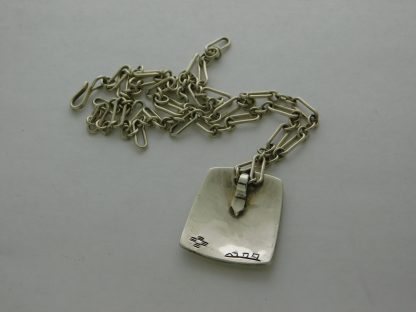 Rear view of Rick Manuel T.O. Quail Pendant