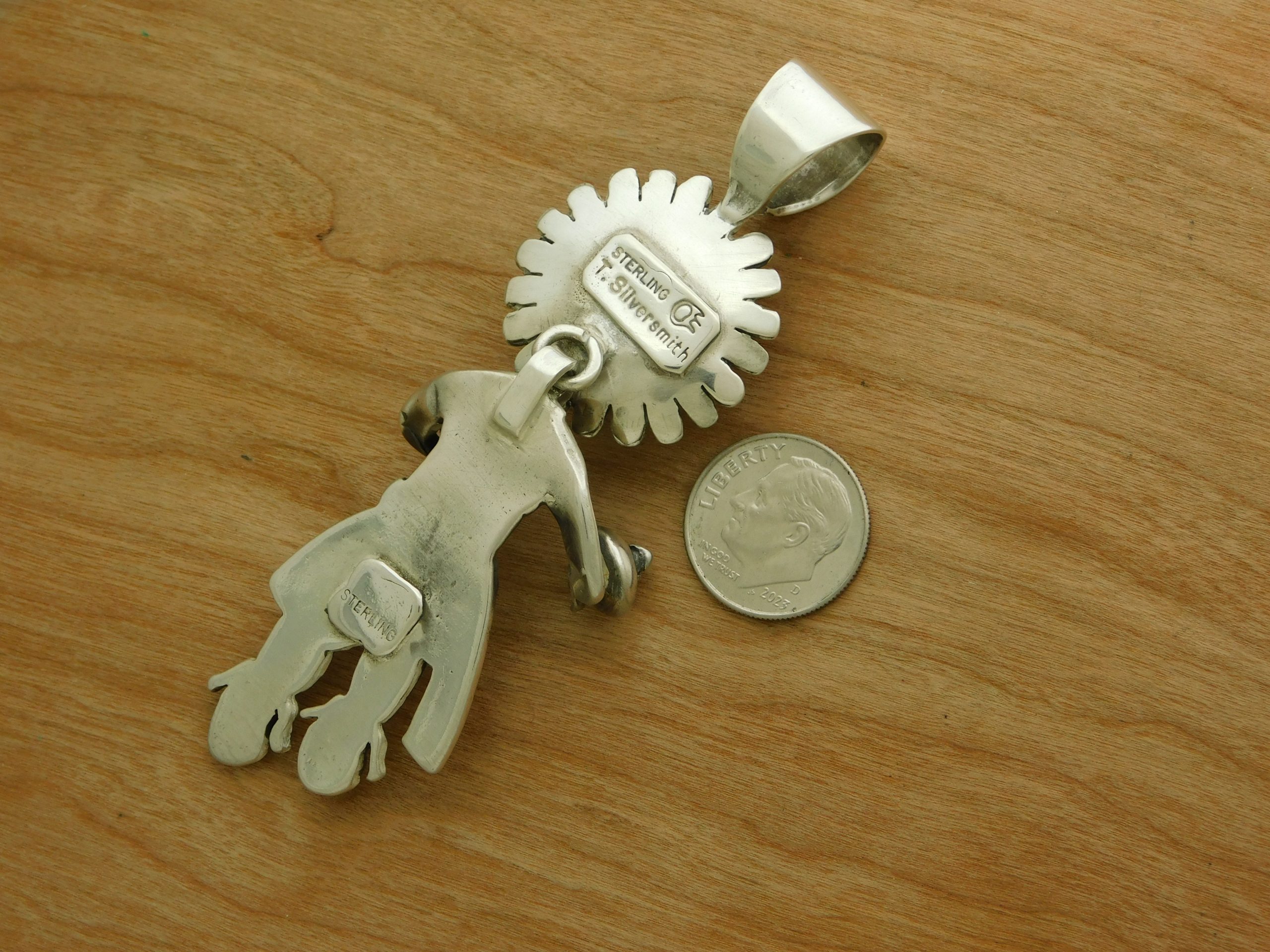 Hallmark on Teddy Silversmith Navajo Sun Kachina Pendant