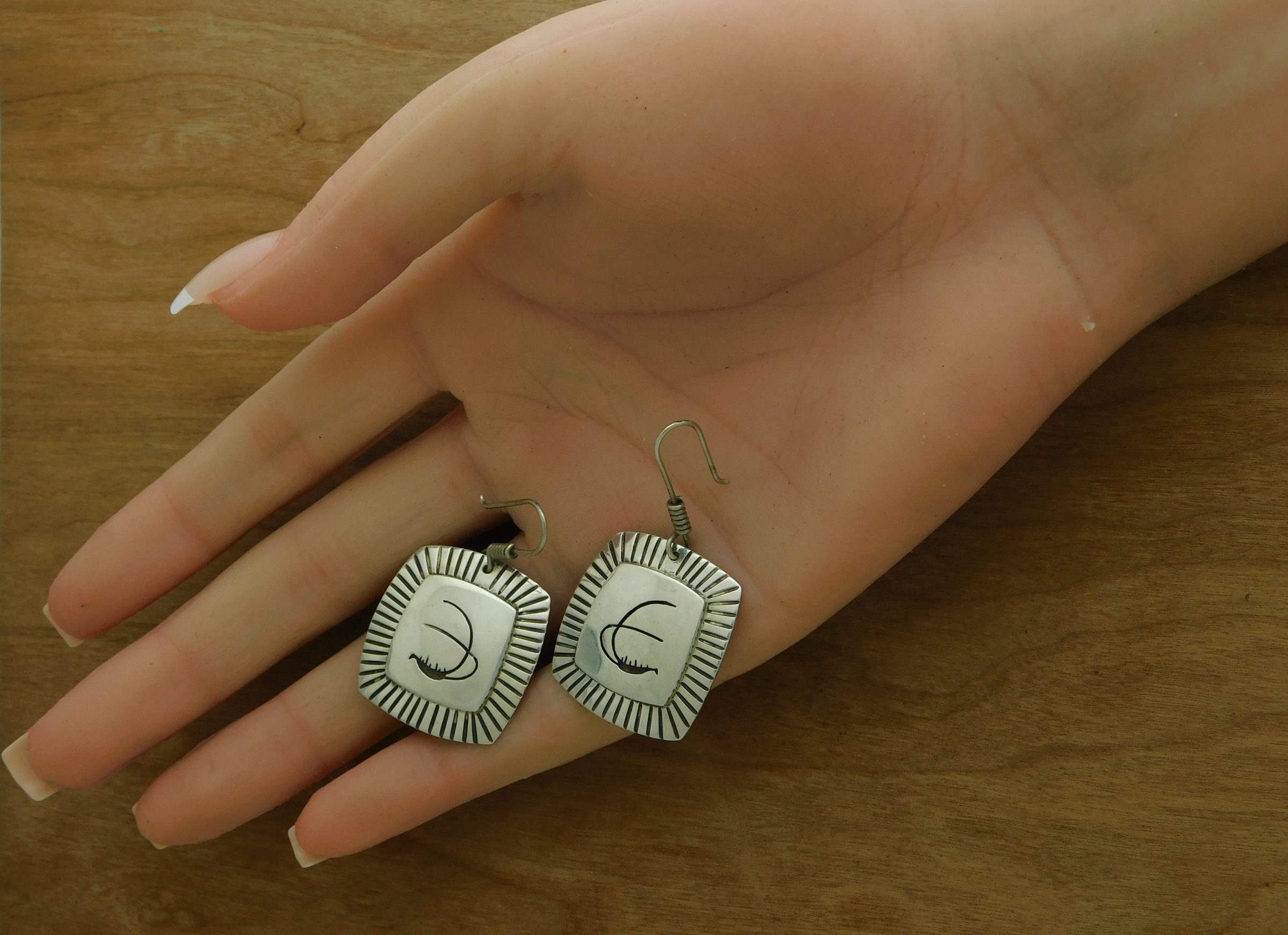 Rick Manuel T.O. Earrings in Hand
